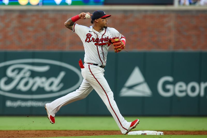 Aug 16, 2023; Atlanta, Georgia, USA; Atlanta Braves shortstop Orlando Arcia (11) throws a runner out at first against the New York Yankees in the third inning at Truist Park. Mandatory Credit: Brett Davis-USA TODAY Sports
