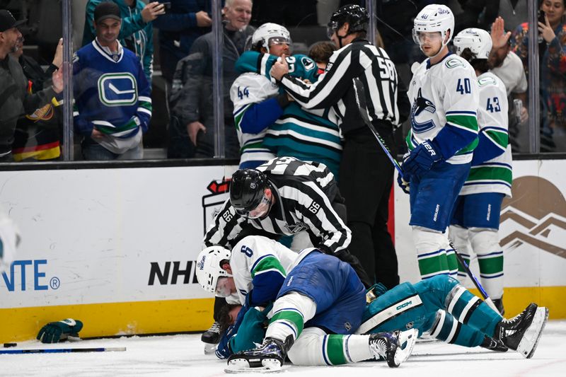 Nov 28, 2025; San Jose, California, USA; Vancouver Canucks right winger Brock Boeser (6) and San Jose Sharks center Ty Dellandrea (10) get in a fight in the third period at SAP Center at San Jose. Mandatory Credit: Eakin Howard-Imagn Images