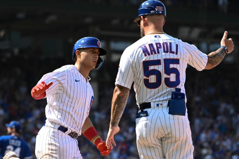 Aug 20, 2023; Chicago, Illinois, USA; Chicago Cubs catcher Miguel Amaya (6) high fives Chicago Cubs first base coach Mike Napoli (55) after hitting a home run against the Kansas City Royals during the eighth inning at Wrigley Field. Mandatory Credit: Matt Marton-USA TODAY Sports