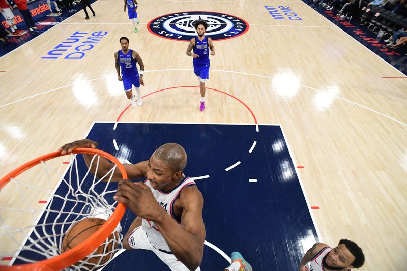INGLEWOOD, CA - OCTOBER 14: Kai Jones #23 of the LA Clippers dunks the ball during the game against the Dallas Mavericks during a NBA Preseason game on October 14, 2024 at the Intuit Dome in Inglewood, California. NOTE TO USER: User expressly acknowledges and agrees that, by downloading and/or using this Photograph, user is consenting to the terms and conditions of the Getty Images License Agreement. Mandatory Copyright Notice: Copyright 2024 NBAE (Photo by Adam Pantozzi/NBAE via Getty Images)