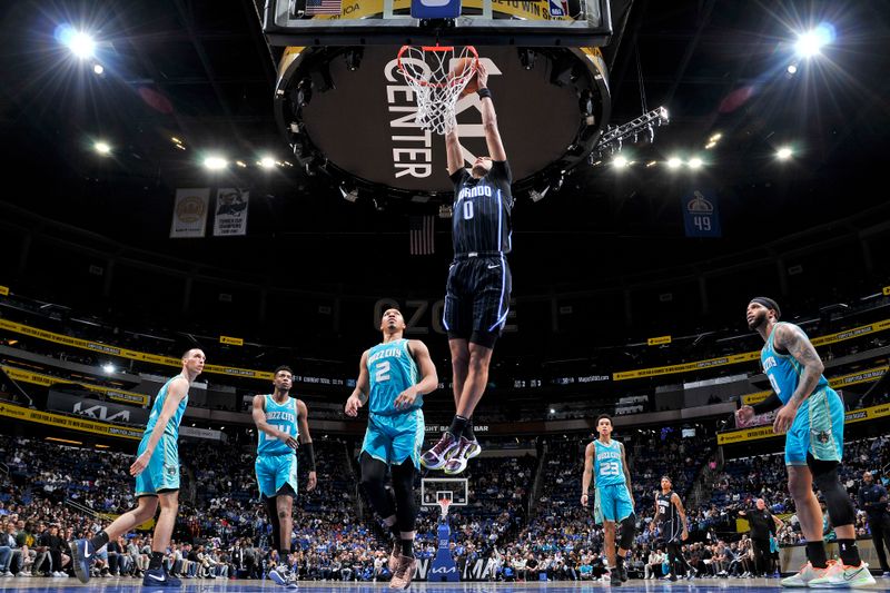 ORLANDO, FL - MARCH 19: Anthony Black #0 of the Orlando Magic dunks the ball during the game against the Charlotte Hornets on March 19, 2024 at the Kia Center in Orlando, Florida. NOTE TO USER: User expressly acknowledges and agrees that, by downloading and or using this photograph, User is consenting to the terms and conditions of the Getty Images License Agreement. Mandatory Copyright Notice: Copyright 2024 NBAE (Photo by Fernando Medina/NBAE via Getty Images)