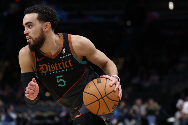 WASHINGTON, DC - FEBRUARY 25: Tyus Jones #5 of the Washington Wizards dribbles against the Cleveland Cavaliers at Capital One Arena on February 25, 2024 in Washington, DC. NOTE TO USER: User expressly acknowledges and agrees that, by downloading and or using this photograph, User is consenting to the terms and conditions of the Getty Images License Agreement. (Photo by Patrick Smith/Getty Images)