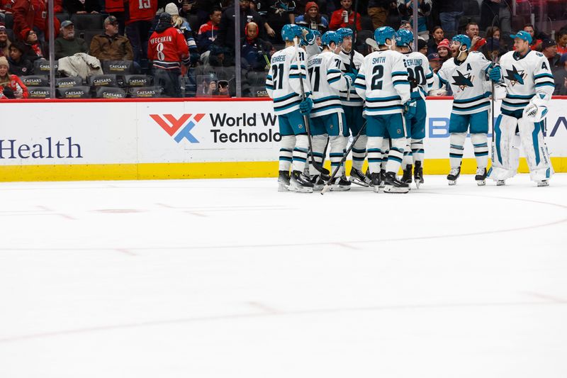 Dec 3, 2024; Washington, District of Columbia, USA; San Jose Sharks left wing William Eklund (72) celebrates with teammates after scoring the game-winning goal against the Washington Capitals in overtime at Capital One Arena. Mandatory Credit: Geoff Burke-Imagn Images