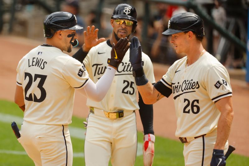 Aug 4, 2024; Minneapolis, Minnesota, USA; Minnesota Twins third baseman Royce Lewis (23) celebrates with center fielder Byron Buxton (25) and right fielder Max Kepler (26) after a three run home run against the Chicago White Sox in the second inning at Target Field. Mandatory Credit: Bruce Kluckhohn-USA TODAY Sports