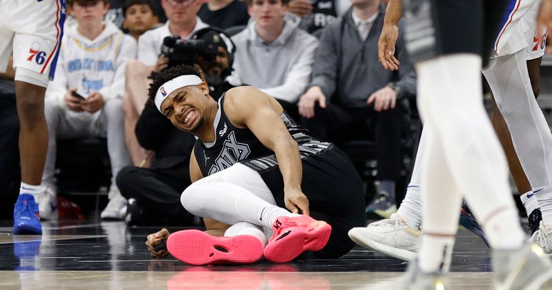 SAN ANTONIO, TX - APRIL 07: Keldon Johnson #3 of the San Antonio Spurs reacts after an injury against the Philadelphia 76ers in the second half at Frost Bank Center on April 7, 2024 in San Antonio, Texas. NOTE TO USER: User expressly acknowledges and agrees that, by downloading and or using this photograph, User is consenting to terms and conditions of the Getty Images License Agreement. (Photo by Ronald Cortes/Getty Images)