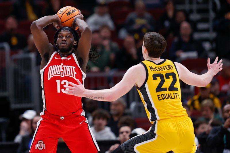 Mar 9, 2023; Chicago, IL, USA; Ohio State Buckeyes guard Isaac Likekele (13) looks to pass the ball against Iowa Hawkeyes forward Patrick McCaffery (22) during the first half at United Center. Mandatory Credit: Kamil Krzaczynski-USA TODAY Sports