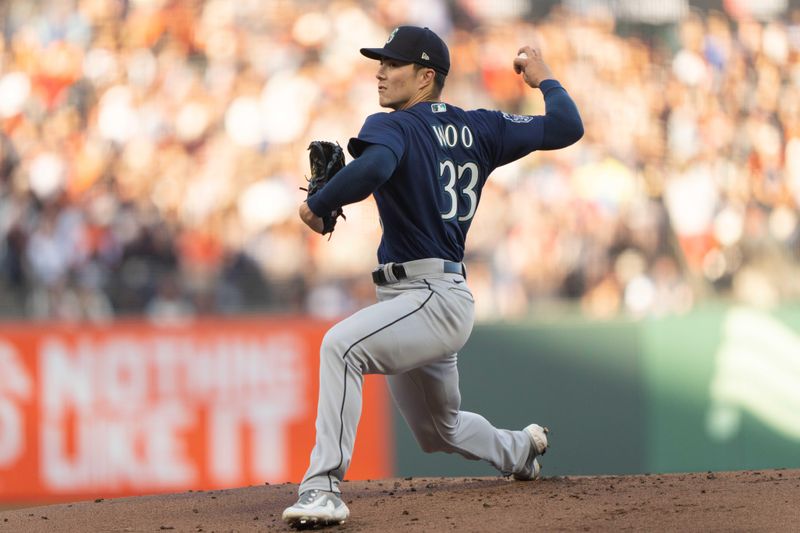 Jul 3, 2023; San Francisco, California, USA;  Seattle Mariners starting pitcher Bryan Woo (33) pitches during the first inning against the San Francisco Giants at Oracle Park. Mandatory Credit: Stan Szeto-USA TODAY Sports