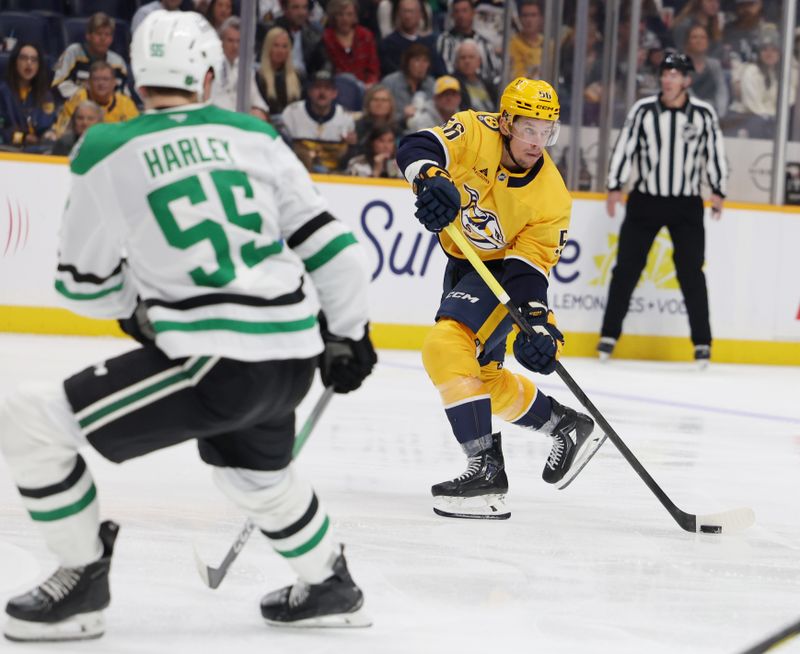 Nov 8, 2025; Nashville, Tennessee, USA; Nashville Predators left wing Erik Haula (56) passes the puck as Dallas Stars defenseman Thomas Harley (55) defends during the third period at Bridgestone Arena. Mandatory Credit: Alan Poizner-Imagn Images