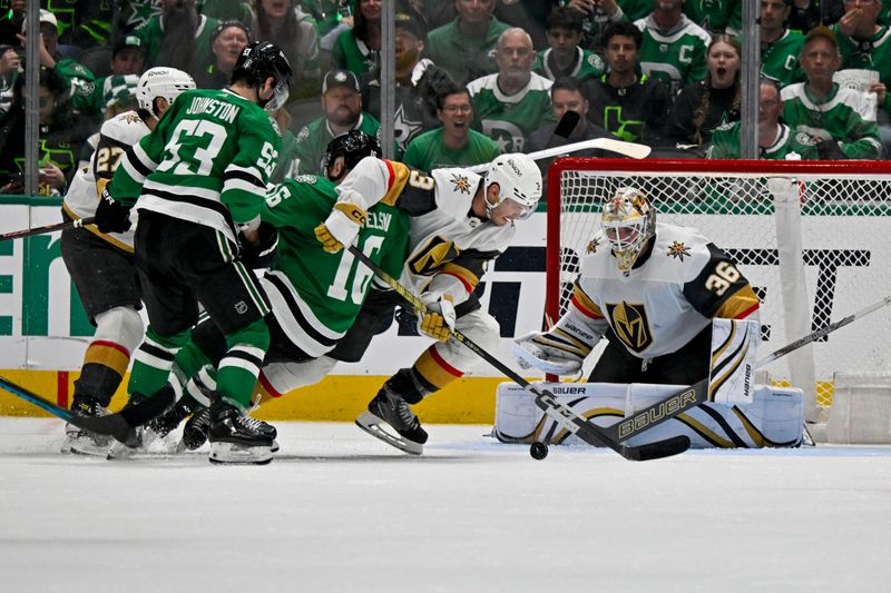 Apr 24, 2024; Dallas, Texas, USA; Vegas Golden Knights goaltender Logan Thompson (36) and defenseman Brayden McNabb (3) and Dallas Stars center Joe Pavelski (16) and center Wyatt Johnston (53) battle for the loose puck in the Vegas crease during the third period in game two of the first round of the 2024 Stanley Cup Playoffs at American Airlines Center. Mandatory Credit: Jerome Miron-USA TODAY Sports