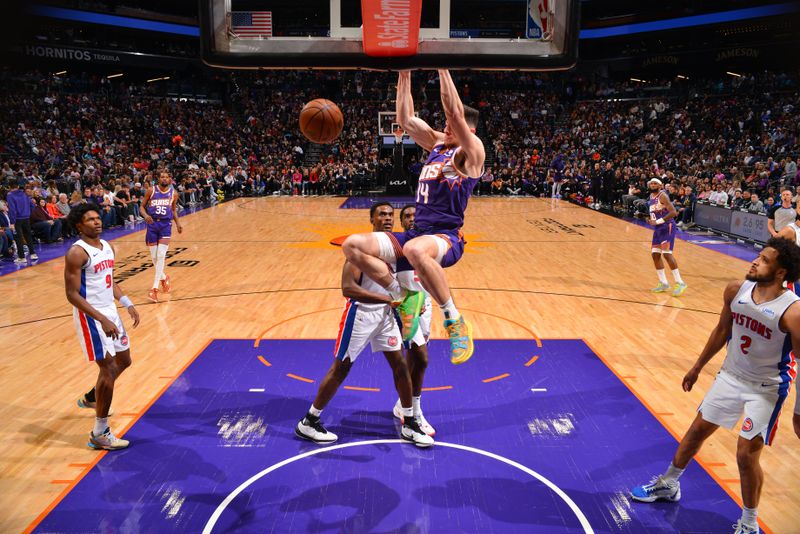 PHOENIX, AZ - FEBRUARY 14:  Drew Eubanks #14 of the Phoenix Suns dunks the ball during the game against the Detroit Pistons on February 14, 2024 at Footprint Center in Phoenix, Arizona. NOTE TO USER: User expressly acknowledges and agrees that, by downloading and or using this photograph, user is consenting to the terms and conditions of the Getty Images License Agreement. Mandatory Copyright Notice: Copyright 2024 NBAE (Photo by Barry Gossage/NBAE via Getty Images)