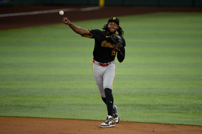 Aug 21, 2024; Arlington, Texas, USA; Pittsburgh Pirates third baseman Jared Triolo (19) throws to first base during the second inning against the Texas Rangers at Globe Life Field. Mandatory Credit: Jerome Miron-USA TODAY Sports