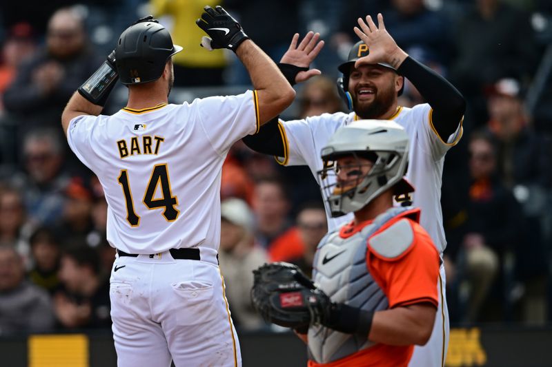 Apr 6, 2024; Pittsburgh, Pennsylvania, USA; Pittsburgh Pirates catcher Joey Bart (14) celebrates with first base Rowdy Tellez (44) after hitting a two run home run against the Baltimore Orioles during the second inning at PNC Park. Mandatory Credit: David Dermer-USA TODAY Sports