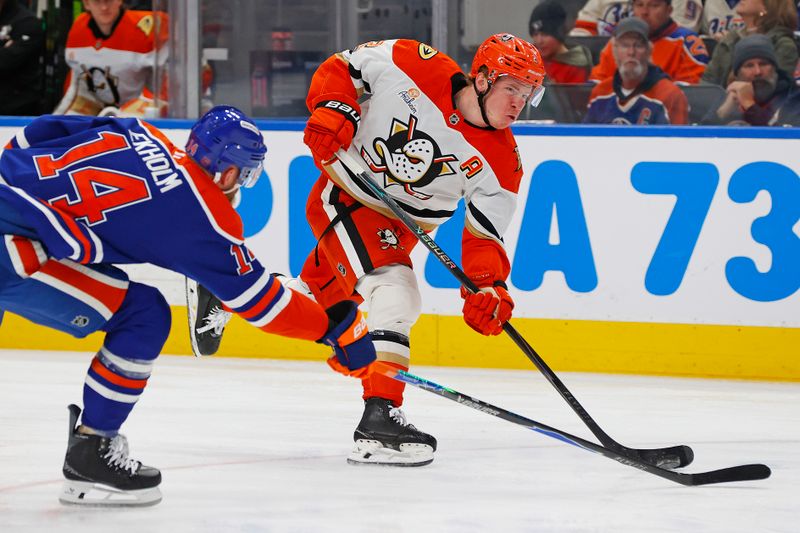 Jan 26, 2026; Edmonton, Alberta, CAN; Edmonton Oilers defensemen Mattias Ekholm (14) tries to blocks a shot by Anaheim Ducks defensemen Jackson LaCombe (2) during the second period at Rogers Place. Mandatory Credit: Perry Nelson-Imagn Images