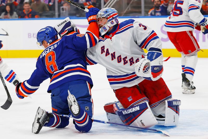 Nov 23, 2024; Edmonton, Alberta, CAN; New York Rangers goaltender Jonathan Quick (32) takes a swipe at Edmonton Oilers forward Drake Caggiula (8) during the third period at Rogers Place. Mandatory Credit: Perry Nelson-Imagn Images