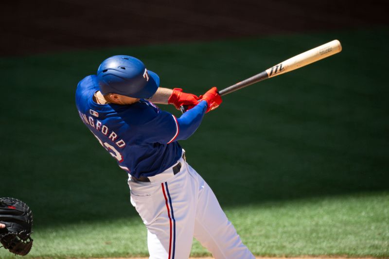 Mar 26, 2024; Arlington, Texas, USA; Texas Rangers left field Wyatt Langford (82) hits a double against the Boston Red Sox during the fourth inning at Globe Life Field. Mandatory Credit: Jerome Miron-USA TODAY Sports