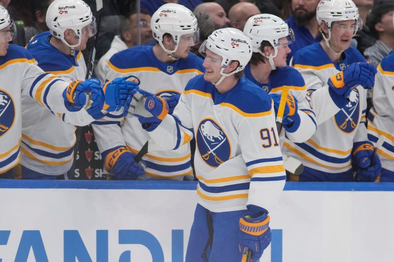 Jan 27, 2026; Toronto, Ontario, CAN; Buffalo Sabres forward Josh Doan (91) gets congratulated after scoring against the Toronto Maple Leafs during the first period at Scotiabank Arena. Mandatory Credit: John E. Sokolowski-Imagn Images