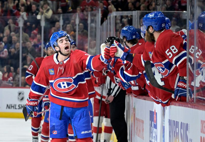 Apr 16, 2024; Montreal, Quebec, CAN; Montreal Canadiens forward Alex Newhook (15) celebrates with teammates after scoring a goal against the Detroit Red Wings during the first period at the Bell Centre. Mandatory Credit: Eric Bolte-USA TODAY Sports