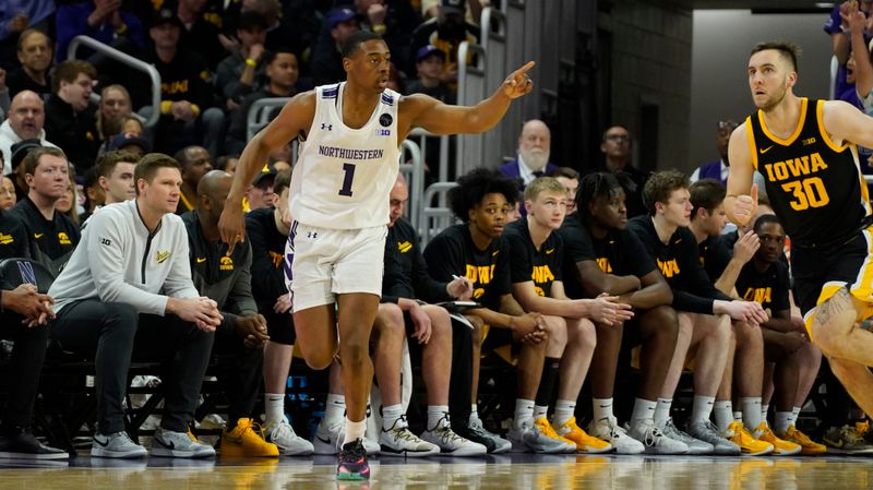 Feb 19, 2023; Evanston, Illinois, USA; Northwestern Wildcats guard Chase Audige (1) gestures after making a three point basket against the Iowa Hawkeyes during the first half at Welsh-Ryan Arena. Mandatory Credit: David Banks-USA TODAY Sports