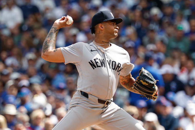 Sep 6, 2024; Chicago, Illinois, USA; New York Yankees starting pitcher Luis Gil (81) delivers a pitch against the Chicago Cubs during the first inning at Wrigley Field. Mandatory Credit: Kamil Krzaczynski-Imagn Images