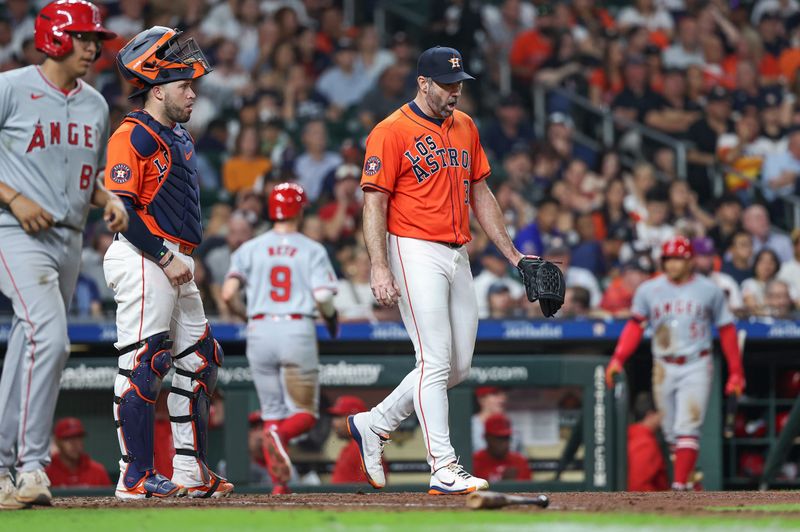 Sep 20, 2024; Houston, Texas, USA; Houston Astros starting pitcher Justin Verlander (35) reacts after a play during the fifth inning against the Los Angeles Angels at Minute Maid Park. Mandatory Credit: Troy Taormina-Imagn Images