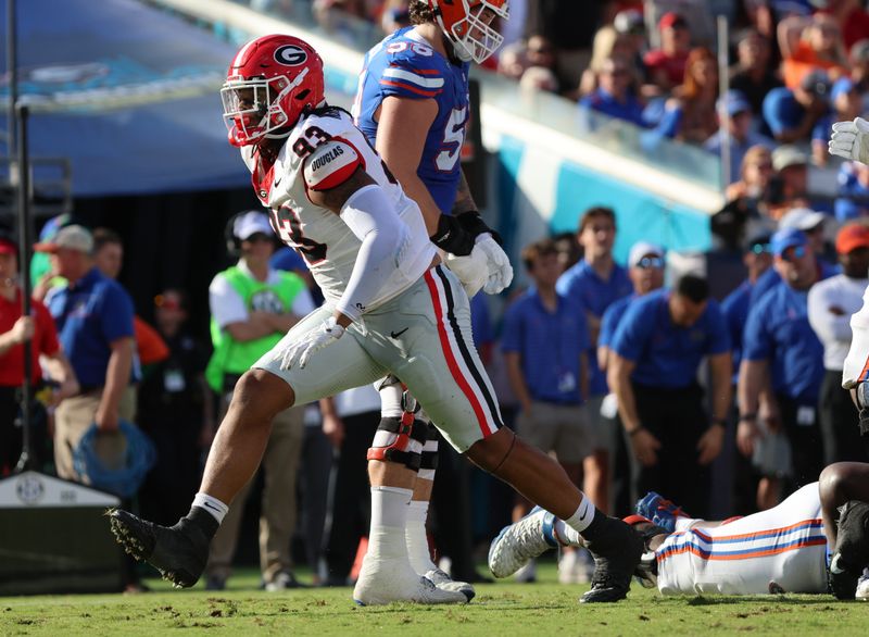 Oct 28, 2023; Jacksonville, Florida, USA; Georgia Bulldogs defensive lineman Tyrion Ingram-Dawkins (93) celebrates after forcing a fumble against the Florida Gators during the first half at EverBank Stadium. Mandatory Credit: Kim Klement Neitzel-USA TODAY Sports