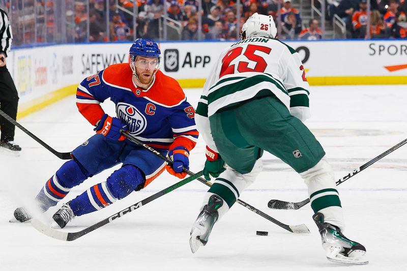 Feb 23, 2024; Edmonton, Alberta, CAN; Edmonton Oilers forward Connor McDavid (97) looks to move the puck past Minnesota Wild defensemen Jonas Brodin (25) during the third period at Rogers Place. Mandatory Credit: Perry Nelson-USA TODAY Sports