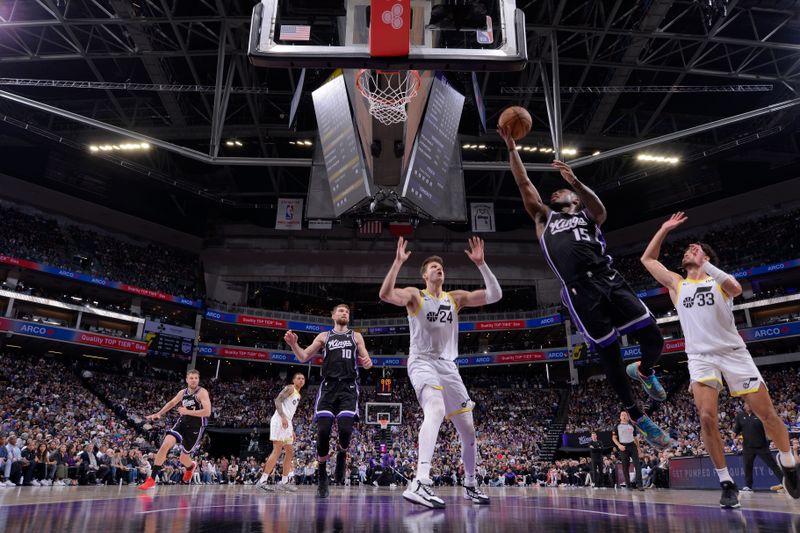 SACRAMENTO, CA - MARCH 31: Davion Mitchell #15 of the Sacramento Kings drives to the basket during the game against the Utah Jazz on March 31, 2024 at Golden 1 Center in Sacramento, California. NOTE TO USER: User expressly acknowledges and agrees that, by downloading and or using this Photograph, user is consenting to the terms and conditions of the Getty Images License Agreement. Mandatory Copyright Notice: Copyright 2024 NBAE (Photo by Rocky Widner/NBAE via Getty Images)