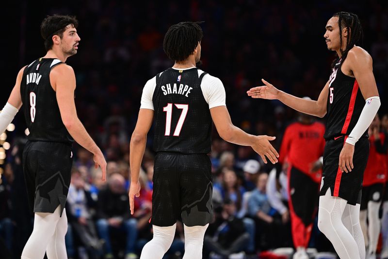 OKLAHOMA CITY, OKLAHOMA - NOVEMBER 20: Shaedon Sharpe #17, Deni Avdija #8 and Dalano Banton #5 of the Portland Trail Blazers celebrate after a big play during the second half against the Oklahoma City Thunder at Paycom Center on November 20, 2024 in Oklahoma City, Oklahoma. NOTE TO USER: User expressly acknowledges and agrees that, by downloading and or using this photograph, User is consenting to the terms and conditions of the Getty Images License Agreement. (Photo by Joshua Gateley/Getty Images)