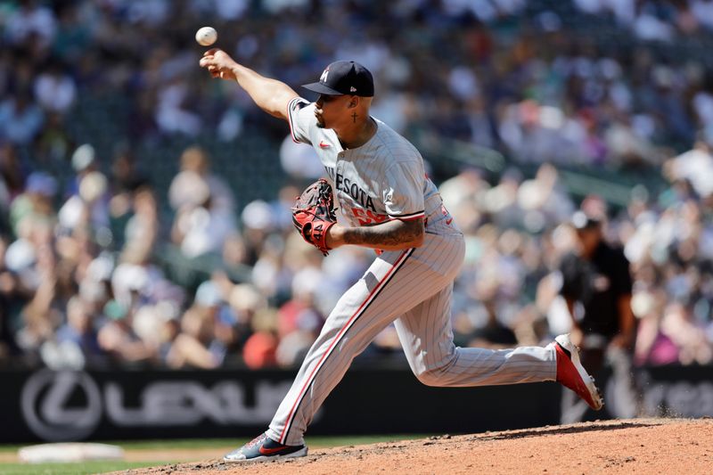 Jun 30, 2024; Seattle, Washington, USA; Minnesota Twins closing pitcher Jhoan Duran (59) throws against the Seattle Mariners during the ninth inning at T-Mobile Park. Mandatory Credit: John Froschauer-USA TODAY Sports