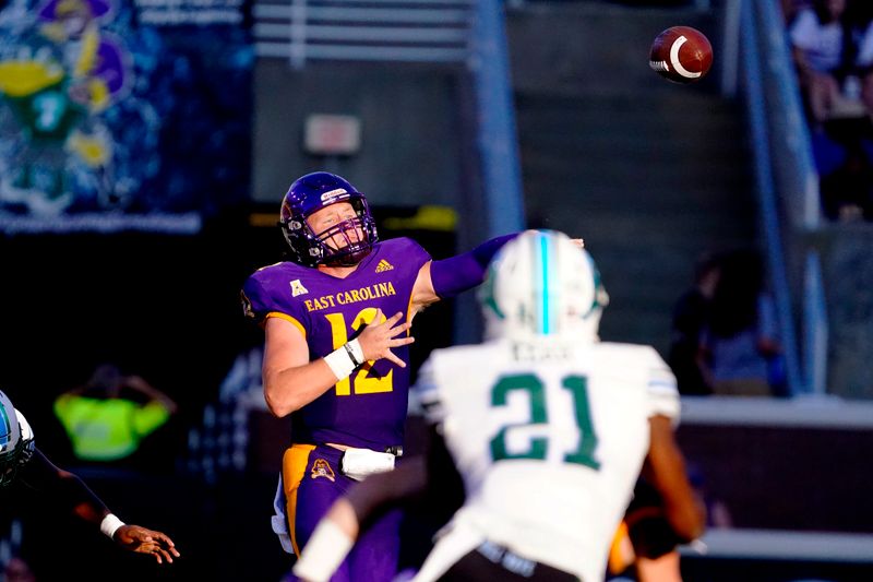 Oct 2, 2021; Greenville, North Carolina, USA;  East Carolina Pirates quarterback Holton Ahlers (12) throws the ball against the Tulane Green Wave during the second half at Dowdy-Ficklen Stadium. Mandatory Credit: James Guillory-USA TODAY Sports