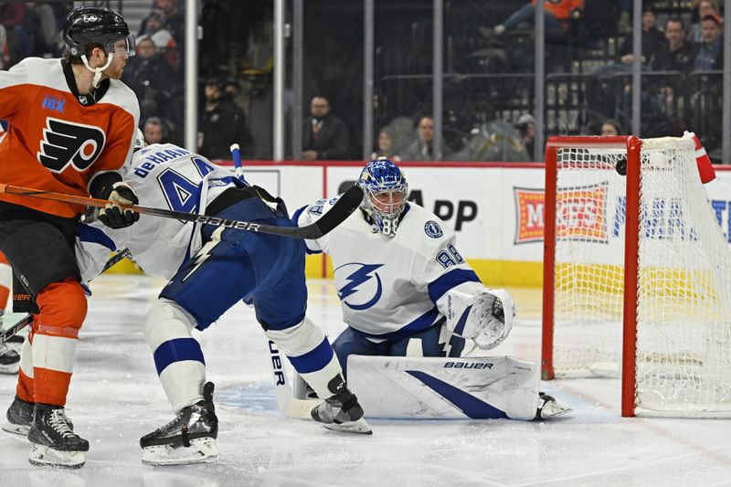 Jan 23, 2024; Philadelphia, Pennsylvania, USA; Philadelphia Flyers defenseman Cam York (8) scores a goal past Tampa Bay Lightning goaltender Andrei Vasilevskiy (88) during the third period at Wells Fargo Center. Mandatory Credit: Eric Hartline-USA TODAY Sports