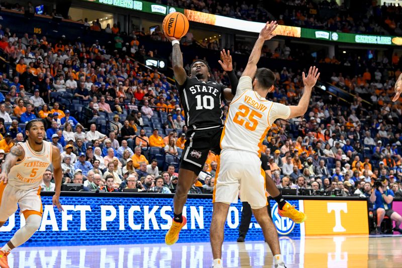 Mar 15, 2024; Nashville, TN, USA; Mississippi State Bulldogs guard Dashawn Davis (10) shoots over Tennessee Volunteers guard Santiago Vescovi (25) during the first half at Bridgestone Arena. Mandatory Credit: Steve Roberts-USA TODAY Sports