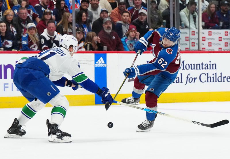 Feb 20, 2024; Denver, Colorado, USA; Vancouver Canucks defenseman Nikita Zadorov (91) blocks the shot of Colorado Avalanche left wing Artturi Lehkonen (62) in the second period at Ball Arena. Mandatory Credit: Ron Chenoy-USA TODAY Sports