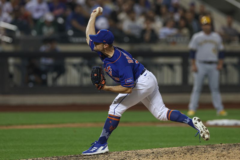 Jun 29, 2023; New York City, New York, USA; New York Mets relief pitcher David Robertson (30) delivers a pitch during the ninth inning against the Milwaukee Brewers at Citi Field. Mandatory Credit: Vincent Carchietta-USA TODAY Sports