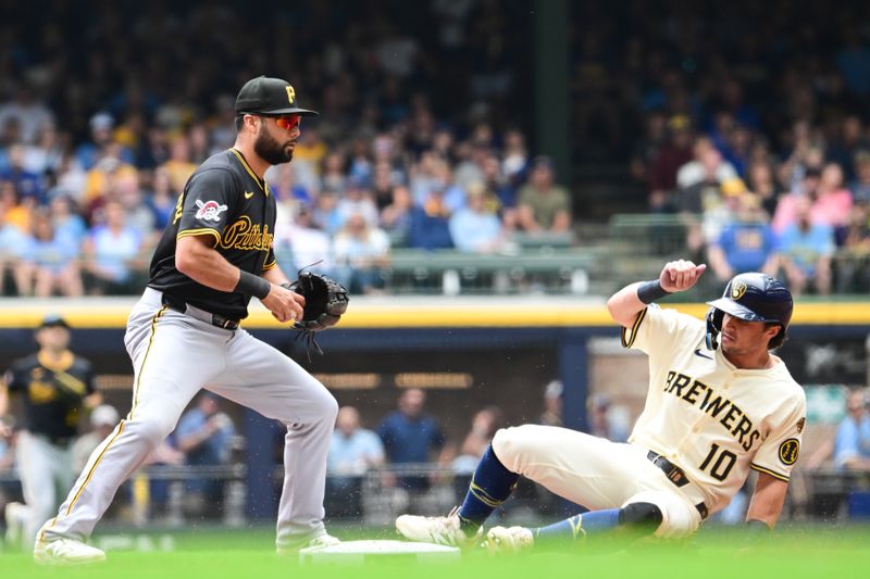 Jun 25, 2025; Milwaukee, Wisconsin, USA;  Pittsburgh Pirates shortstop Isiah Kiner-Falefa forces out Milwaukee Brewers right fielder Sal Frelick (10) in the first inning at American Family Field. Mandatory Credit: Benny Sieu-Imagn Images