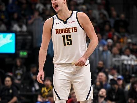 DENVER, CO - DECEMBER 25: Nikola Jokic (15) of the Denver Nuggets instructs teammates during the third quarter against the Golden State Warriors at Ball Arena in Denver on Monday, December 25, 2023. (Photo by AAron Ontiveroz/The Denver Post)