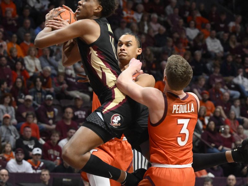 Mar 4, 2023; Blacksburg, Virginia, USA; Florida State Seminoles forward Baba Miller (11) drives to basket against Virginia Tech Hokies guard Sean Pedulla (3) and center Lynn Kidd (15) in the first half at Cassell Coliseum. Mandatory Credit: Lee Luther Jr.-USA TODAY Sports