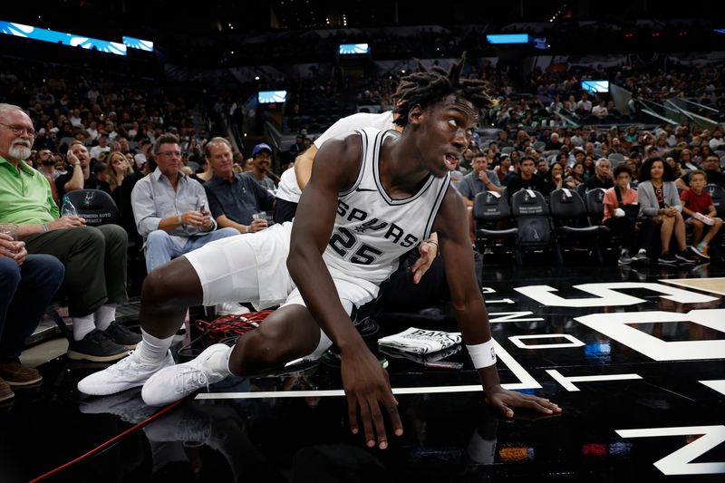 SAN ANTONIO, TX - OCTOBER 07:  Sidy Cissoko #15 of the San Antonio Spurs gets up after diving for a loose ball against the Oklahoma City Thunder in the second half of a preseason game at Frost Bank Center on October 7, 2024 in San Antonio, Texas. NOTE TO USER: User expressly acknowledges and agrees that, by downloading and or using this photograph, User is consenting to terms and conditions of the Getty Images License Agreement. (Photo by Ronald Cortes/Getty Images)