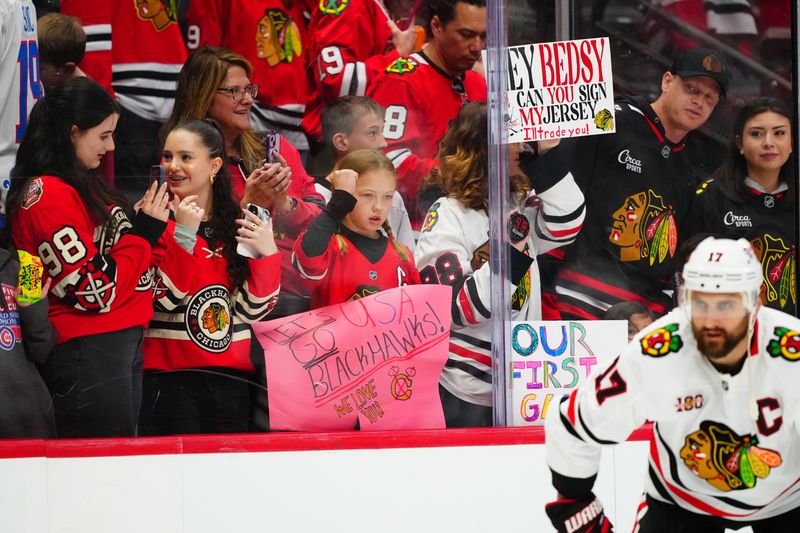 Feb 28, 2026; Denver, Colorado, USA; Chicago Blackhawks cheer in the stands before the game against the Colorado Avalanche at Ball Arena. Mandatory Credit: Ron Chenoy-Imagn Images