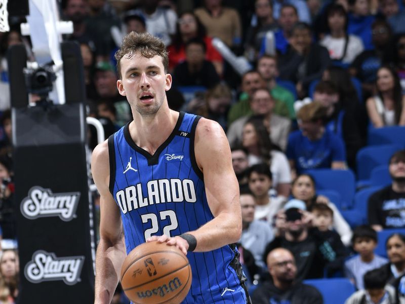 ORLANDO, FL - NOVEMBER 15: Franz Wagner #22 of the Orlando Magic dribbles the ball during the game against the Philadelphia 76ers during the Emirates NBA Cup game on  November 15, 2024 at Kia Center in Orlando, Florida. NOTE TO USER: User expressly acknowledges and agrees that, by downloading and or using this photograph, User is consenting to the terms and conditions of the Getty Images License Agreement. Mandatory Copyright Notice: Copyright 2024 NBAE (Photo by Fernando Medina/NBAE via Getty Images)