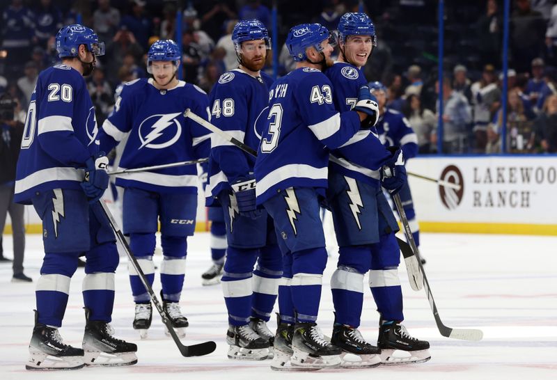 Dec 19, 2023; Tampa, Florida, USA;Tampa Bay Lightning defenseman Haydn Fleury (7) is congratulated by defenseman Darren Raddysh (43) after they beat the St. Louis Blues at Amalie Arena. Mandatory Credit: Kim Klement Neitzel-USA TODAY Sports