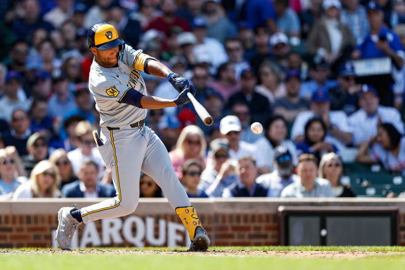 May 3, 2024; Chicago, Illinois, USA; Milwaukee Brewers outfielder Jackson Chourio (11) singles against the Chicago Cubs during the eight inning at Wrigley Field. Mandatory Credit: Kamil Krzaczynski-USA TODAY Sports