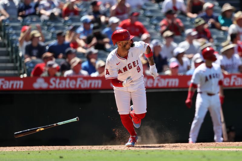 Jun 26, 2024; Anaheim, California, USA;  Los Angeles Angels shortstop Zach Neto (9) hits an RBI double against the Oakland Athletics during the sixth inning at Angel Stadium. Mandatory Credit: Kiyoshi Mio-USA TODAY Sports