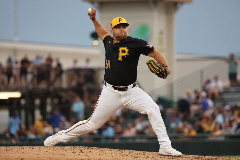 Mar 21, 2024; Bradenton, Florida, USA; Pittsburgh Pirates relief pitcher David Bednar (51) throws a pitch during the fifth inning against the Toronto Blue Jays at LECOM Park. Mandatory Credit: Kim Klement Neitzel-USA TODAY Sports