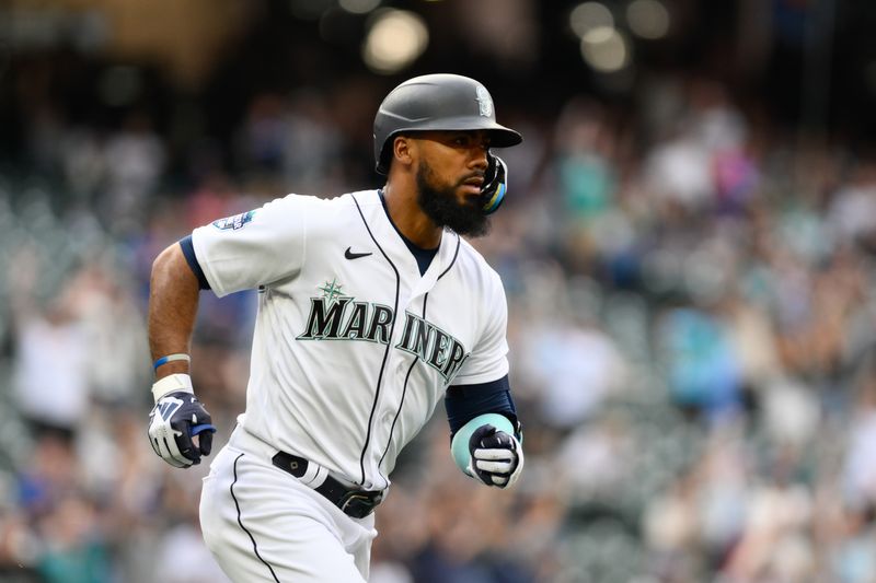 Jun 27, 2023; Seattle, Washington, USA; Seattle Mariners right fielder Teoscar Hernandez (35) runs toward first base after hitting a 2-run home run against the Washington Nationals during the first inning at T-Mobile Park. Mandatory Credit: Steven Bisig-USA TODAY Sports