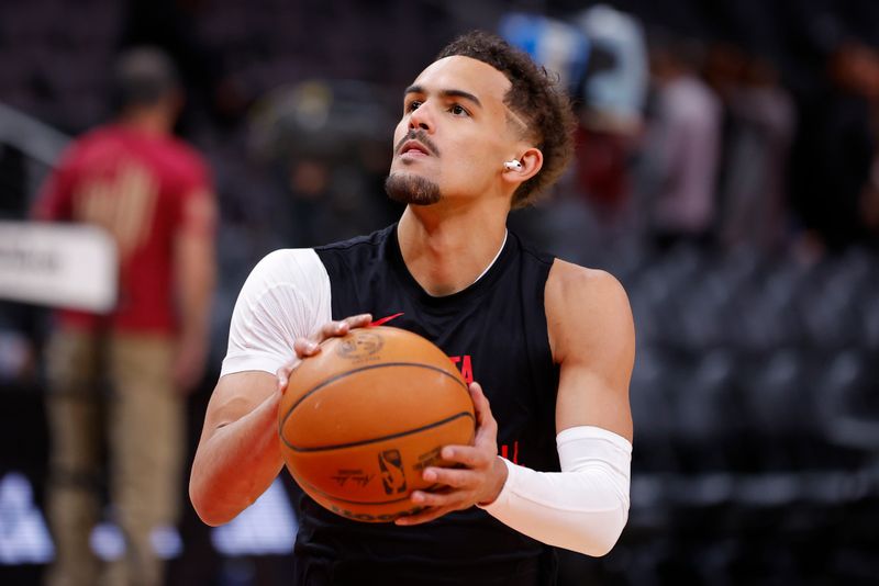 ATLANTA, GEORGIA - JANUARY 17: Trae Young #11 of the Atlanta Hawks warms up prior to the game against the Orlando Magic at State Farm Arena on January 17, 2024 in Atlanta, Georgia. NOTE TO USER: User expressly acknowledges and agrees that, by downloading and or using this photograph, User is consenting to the terms and conditions of the Getty Images License Agreement. (Photo by Todd Kirkland/Getty Images)