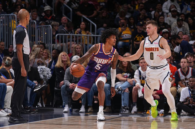 DENVER, CO - OCTOBER 13: Jalen Bridges #15 of the Phoenix Suns dribbles the ball during the game against the Denver Nuggets on October 13, 2024 at Ball Arena in Denver, Colorado. NOTE TO USER: User expressly acknowledges and agrees that, by downloading and/or using this Photograph, user is consenting to the terms and conditions of the Getty Images License Agreement. Mandatory Copyright Notice: Copyright 2024 NBAE (Photo by Bart Young/NBAE via Getty Images)
