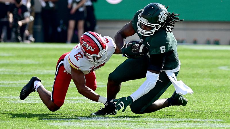 Sep 23, 2023; East Lansing, Michigan, USA;  Michigan State Spartans tight end Maliq Carr (6) grabs a pass in the first quarter against Maryland Terrapins defensive back Dante Trader Jr. (12) at Spartan Stadium. Mandatory Credit: Dale Young-USA TODAY Sports