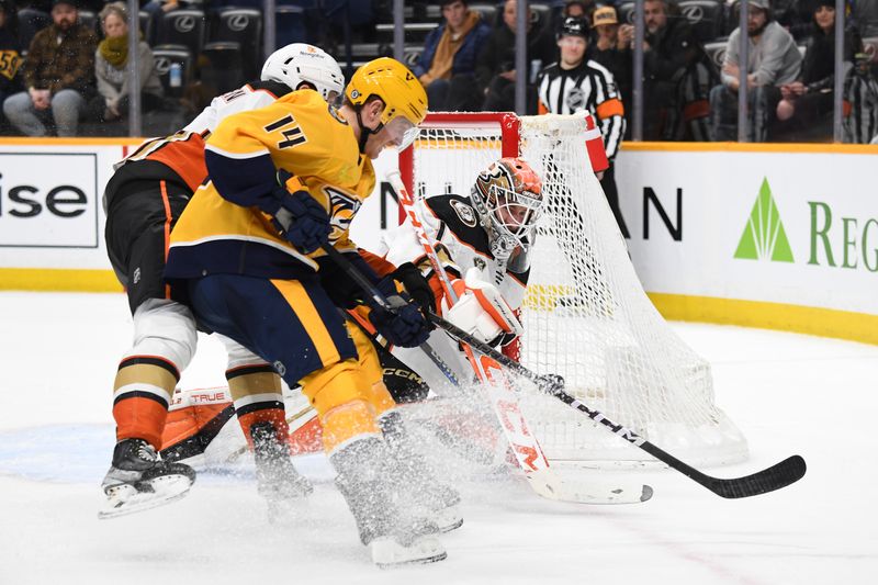 Jan 9, 2024; Nashville, Tennessee, USA; Anaheim Ducks goaltender Lukas Dostal (1) makes a save at the side of the net during the third period against the Nashville Predators at Bridgestone Arena. Mandatory Credit: Christopher Hanewinckel-USA TODAY Sports