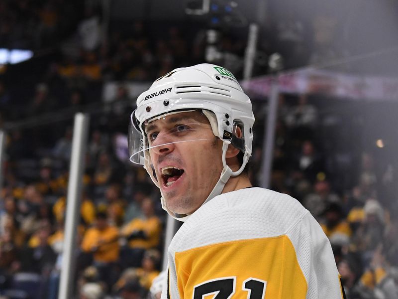 Nov 28, 2023; Nashville, Tennessee, USA; Pittsburgh Penguins center Evgeni Malkin (71) celebrates after a goal during the second period against the Nashville Predators at Bridgestone Arena. Mandatory Credit: Christopher Hanewinckel-USA TODAY Sports